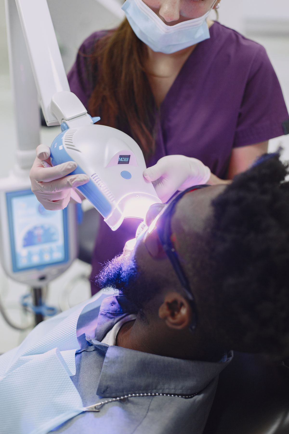 Patient receiving professional Zoom whitening treatment